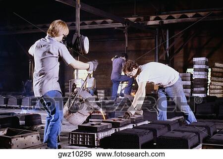 Foundry workers working in a metal industry, Belgium Foundry, Wisconsin, USA View Large Photo Image Stock Photography - Foundry workers working in a metal industry, Belgium Foundry, Wisconsin, USA. Fotosearch