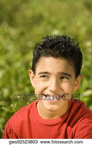 High angle view of a boy looking up View Large Photo Image Stock Image - High angle view of a boy looking up. Fotosearch
