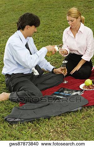 High angle view of a businessman pouring champagne into a glass View Large Photo Image Stock Image - High angle view of a businessman pouring champagne into a glass. Fotosearch