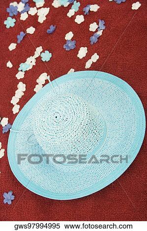 High angle view of a hat with artificial flowers on a picnic blanket View Large Photo Image Stock Photography - High angle view of a hat with artificial flowers on a picnic blanket. Fotosearch