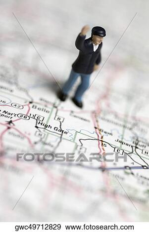High angle view of a human figurine on a road map View Large Photo Image Stock Photo - High angle view of a human figurine on a road map. Fotosearch
