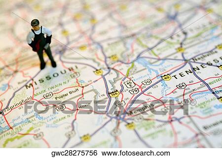 High angle view of a human figurine on a road map View Large Photo Image Stock Photograph - High angle view of a human figurine on a road map. Fotosearch