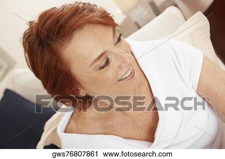 High angle view of a senior woman smiling View Large Photo Image Stock Image - High angle view of a senior woman smiling. Fotosearch