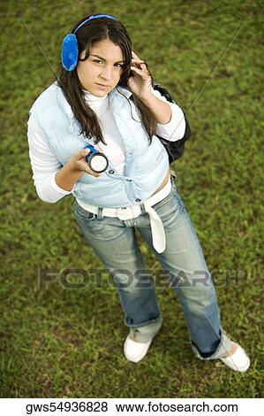 High angle view of a teenage girl holding a flashlight View Large Photo Image Stock Photo - High angle view of a teenage girl holding a flashlight. Fotosearch