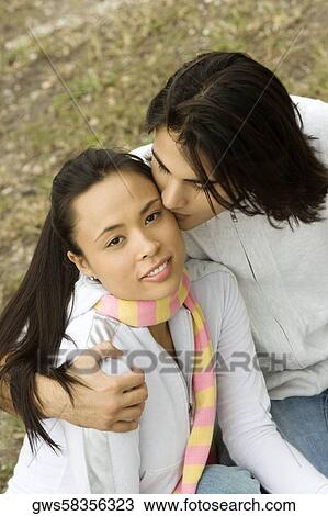 High angle view of a young man kissing a young woman View Large Photo Image Stock Image - High angle view of a young man kissing a young woman. Fotosearch