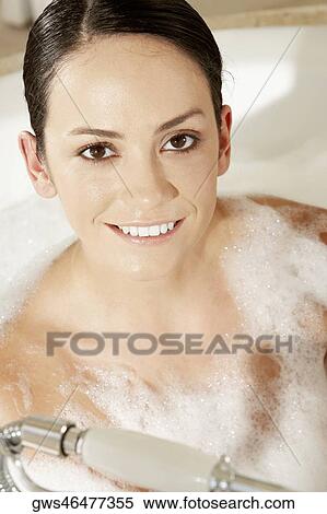 High angle view of a young woman sitting in the bathtub View Large Photo Image Stock Photography - High angle view of a young woman sitting in the bathtub. Fotosearch