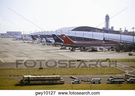 High angle view of airplanes at an airport, Kansai International Airport, Osaka, Japan View Large Photo Image Stock Photo - High angle view of airplanes at an airport, Kansai International Airport, Osaka, Japan. Fotosearch