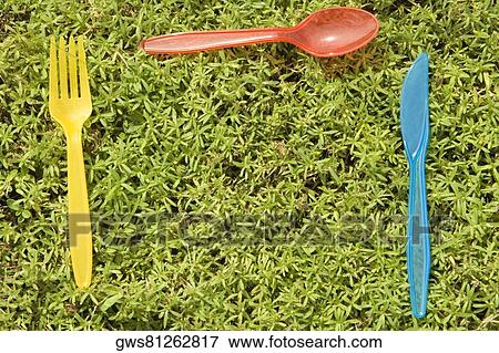 High angle view of disposable cutlery on the grass View Large Photo Image Stock Photo - High angle view of disposable cutlery on the grass. Fotosearch