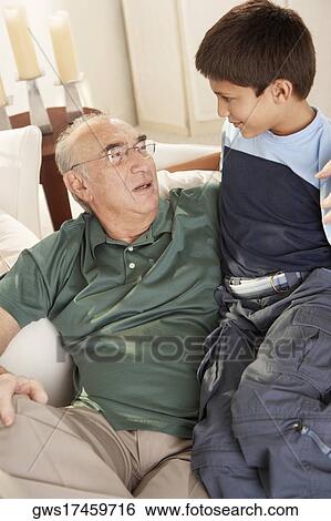 High angle view of grandfather looking at his grandson View Large Photo Image Stock Photograph - High angle view of grandfather looking at his grandson. Fotosearch