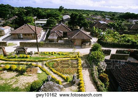 High angle view of houses in a village, Taketomi, Okinawa Prefecture, Japan View Large Photo Image Stock Image - High angle view of houses in a village, Taketomi, Okinawa Prefecture, Japan. Fotosearch