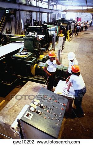 High angle view of manual workers at a steel mill, Eastern Stainless Steel, Baltimore, Maryland, USA View Large Photo Image Stock Image - High angle view of manual workers at a steel mill, Eastern Stainless Steel, Baltimore, Maryland, USA. Fotosearch