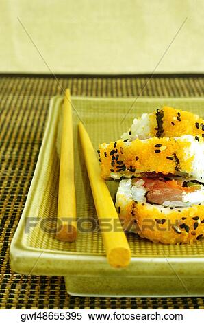High angle view of sushi on a serving tray with a pair of chopsticks View Large Photo Image Stock Photography - High angle view of sushi on a serving tray with a pair of chopsticks. Fotosearch