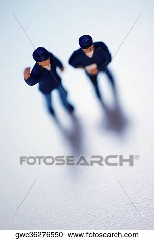 High angle view of two human figurines View Large Photo Image Stock Image - High angle view of two human figurines. Fotosearch