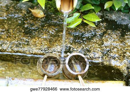 High angle view of water flowing from a pipe into the buckets, Ryoanji Temple, Kyoto, Japan View Large Photo Image Stock Photograph - High angle view of water flowing from a pipe into the buckets, Ryoanji Temple, Kyoto, Japan. Fotosearch