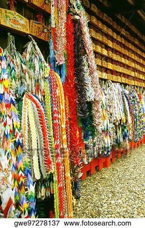 Large group of origami products hanging on the wall View Large Photo Image Stock Photo - Large group of origami products hanging on the wall. Fotosearch