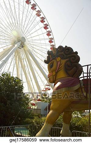 Low angle view of a ferris wheel in an amusement park, Navy Pier Park, Chicago, Illinois, USA View Large Photo Image Stock Photo - Low angle view of a ferris wheel in an amusement park, Navy Pier Park, Chicago, Illinois, USA. Fotosearch