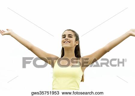 Low angle view of a girl standing with her arms outstretched View Large Photo Image Stock Image - Low angle view of a girl standing with her arms outstretched. Fotosearch