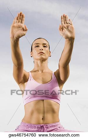 Low angle view of a mid adult woman exercising View Large Photo Image Stock Image - Low angle view of a mid adult woman exercising. Fotosearch