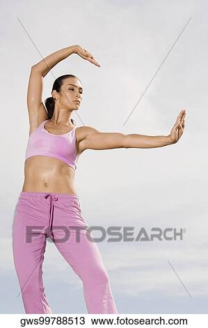 Low angle view of a mid adult woman exercising View Large Photo Image Stock Image - Low angle view of a mid adult woman exercising. Fotosearch