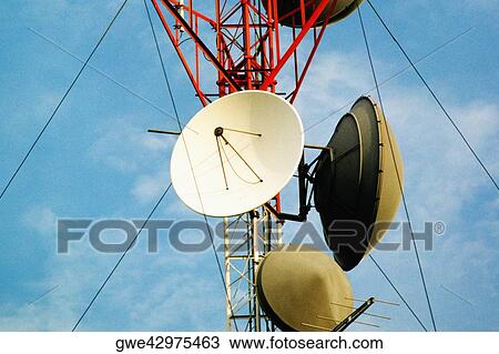 Low angle view of a satellite dish on a communication tower View Large Photo Image Stock Image - Low angle view of a satellite dish on a communication tower. Fotosearch