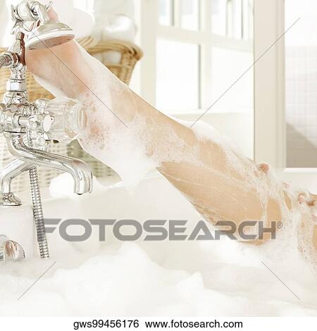 Low section view of a woman's leg in the bathtub View Large Photo Image Stock Photograph - Low section view of a woman's leg in the bathtub. Fotosearch