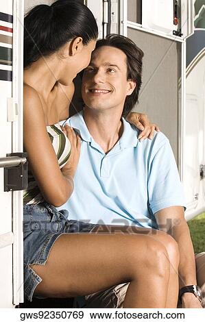 Mid adult man and a young woman looking at each other View Large Photo Image Stock Photo - Mid adult man and a young woman looking at each other. Fotosearch