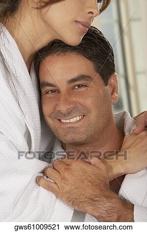 Mid adult woman embracing a mid adult man View Large Photo Image Stock Image - Mid adult woman embracing a mid adult man. Fotosearch