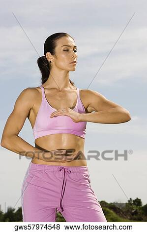 Mid adult woman exercising View Large Photo Image Stock Photo - Mid adult woman exercising. Fotosearch