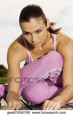 Mid adult woman exercising View Large Photo Image Stock Photograph - Mid adult woman exercising. Fotosearch