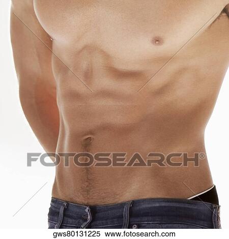 Mid section view of a bare chested young man View Large Photo Image Stock Photography - Mid section view of a bare chested young man. Fotosearch