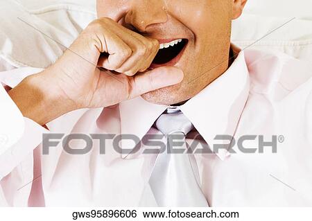 Mid section view of a businessman yawning View Large Photo Image Stock Photograph - Mid section view of a businessman yawning. Fotosearch
