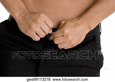 Mid section view of a man buttoning his pants View Large Photo Image Stock Photo - Mid section view of a man buttoning his pants. Fotosearch