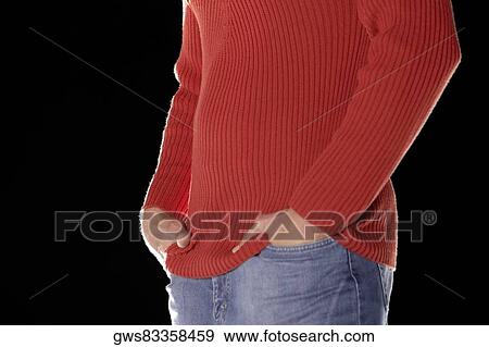 Mid section view of a man with his hands in his pockets View Large Photo Image Stock Photo - Mid section view of a man with his hands in his pockets. Fotosearch