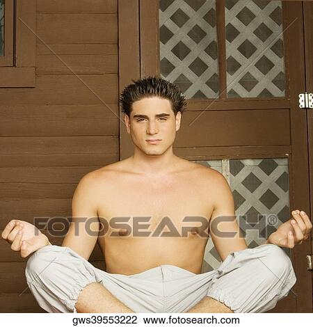 Portrait of a bare chested young man sitting in a lotus position View Large Photo Image Stock Image - Portrait of a bare chested young man sitting in a lotus position. Fotosearch
