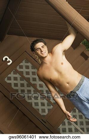 Portrait of a bare chested young man smiling View Large Photo Image Stock Image - Portrait of a bare chested young man smiling. Fotosearch
