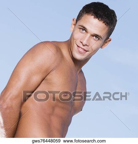 Portrait of a bare chested young man smiling View Large Photo Image Stock Photo - Portrait of a bare chested young man smiling. Fotosearch