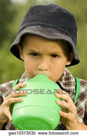 Portrait of a boy drinking water View Large Photo Image Stock Photography - Portrait of a boy drinking water. Fotosearch