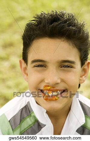 Stock Image - Portrait of a boy smiling with a messy face. Fotosearch