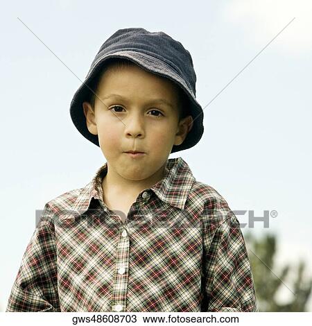 Portrait of a boy wearing a hat View Large Photo Image Stock Image - Portrait of a boy wearing a hat. Fotosearch