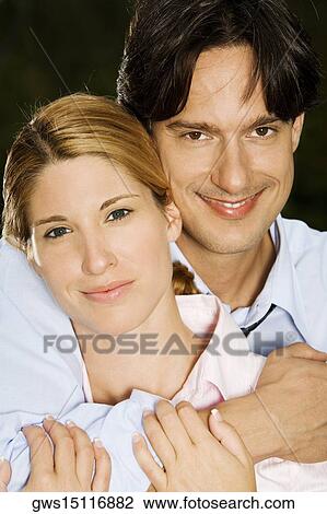 Portrait of a businessman embracing a businesswoman View Large Photo Image Stock Image - Portrait of a businessman embracing a businesswoman. Fotosearch