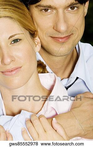 Portrait of a businessman embracing a businesswoman View Large Photo Image Stock Photo - Portrait of a businessman embracing a businesswoman. Fotosearch