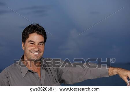 Stock Image - Portrait of a businessman smiling. Fotosearch