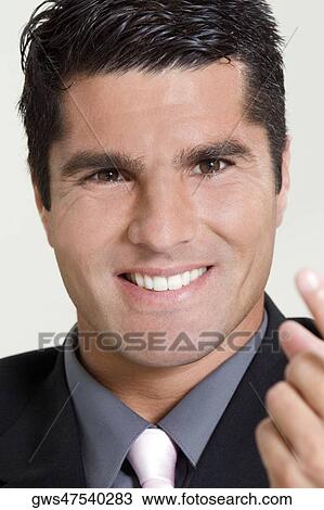 Portrait of a businessman smiling View Large Photo Image Stock Image - Portrait of a businessman smiling. Fotosearch