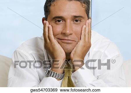 Portrait of a businessman smiling View Large Photo Image Stock Photo - Portrait of a businessman smiling. Fotosearch