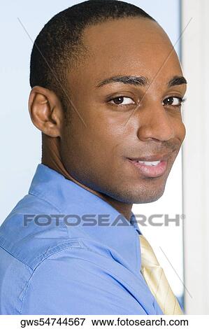 Portrait of a businessman smiling View Large Photo Image Stock Photo - Portrait of a businessman smiling. Fotosearch