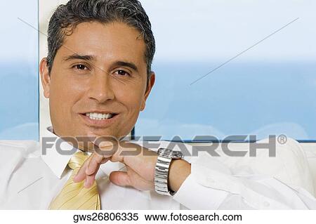 Portrait of a businessman smiling View Large Photo Image Stock Photography - Portrait of a businessman smiling. Fotosearch