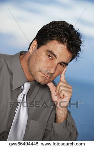 Portrait of a businessman thinking View Large Photo Image Stock Photography - Portrait of a businessman thinking. Fotosearch