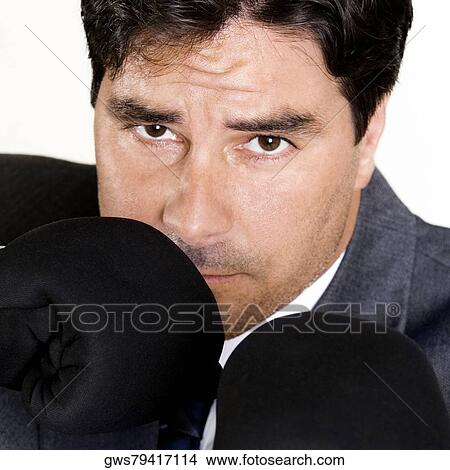 Portrait of a businessman wearing boxing gloves View Large Photo Image Picture - Portrait of a businessman wearing boxing gloves. Fotosearch