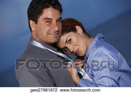 Portrait of a businesswoman holding a businessman's tie View Large Photo Image Stock Image - Portrait of a businesswoman holding a businessman's tie. Fotosearch