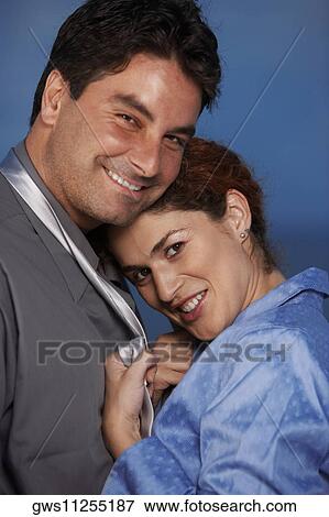 Portrait of a businesswoman holding a businessman's tie View Large Photo Image Stock Photo - Portrait of a businesswoman holding a businessman's tie. Fotosearch